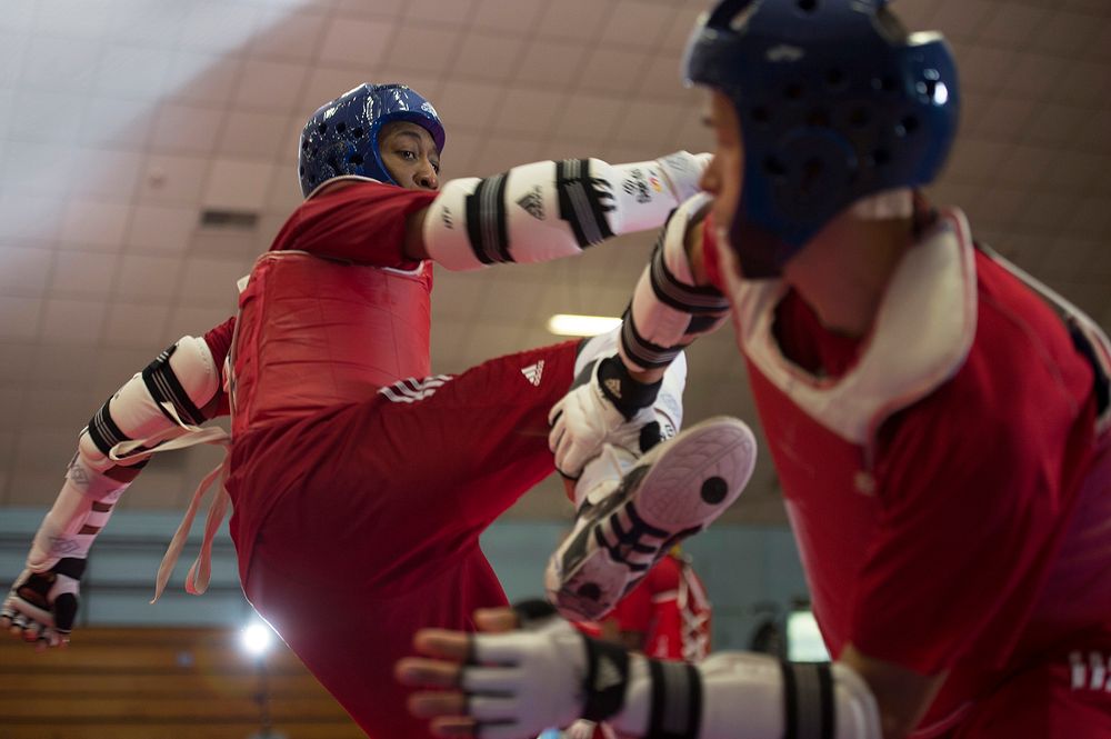 Army 1st Lt. Joshua Fletcher, right, and Air Force Tech Sgt. Quinton Beach spar during U.S. Armed Forces Tae Kwon Do Team…