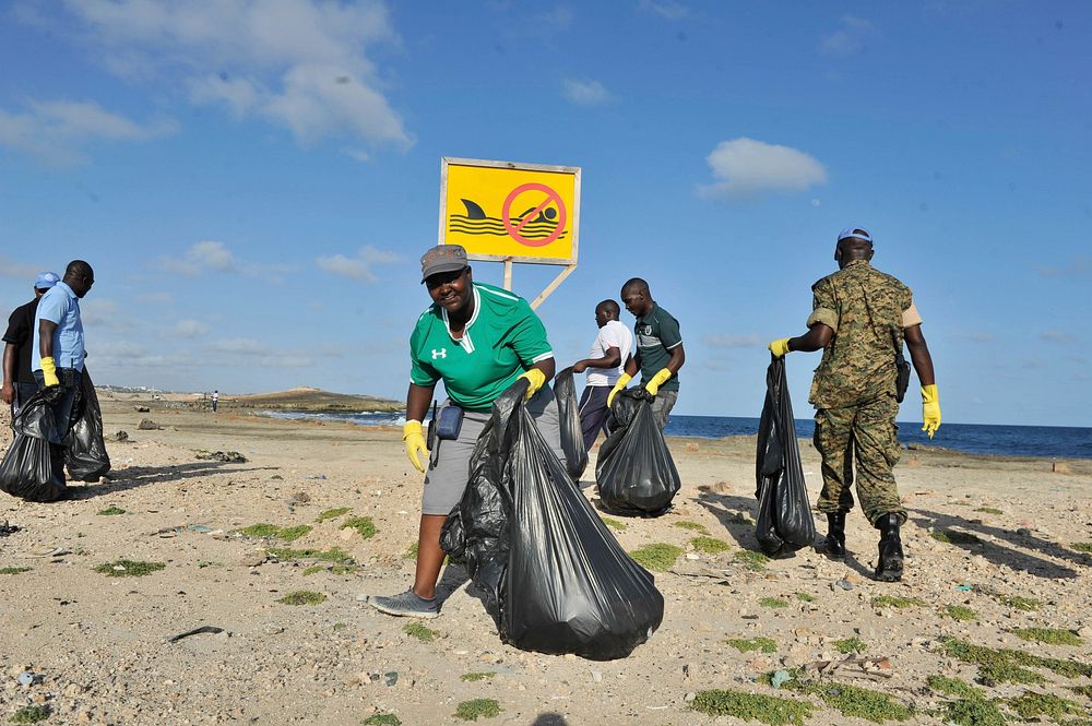 Staff of the United Nations in Somalia collect garbage during a clean-up exercise of the seashore in Mogadishu, Somalia. The…