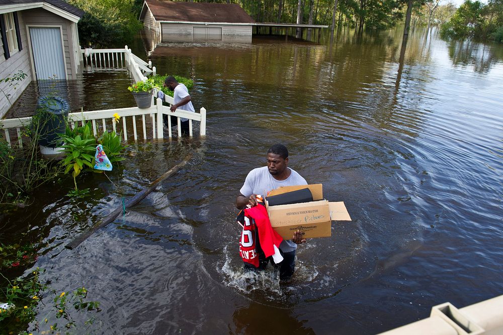 Former NFL player Robert Geathers retrieves any possessions not destroyed by the flood at his family home in Brown's Ferry…