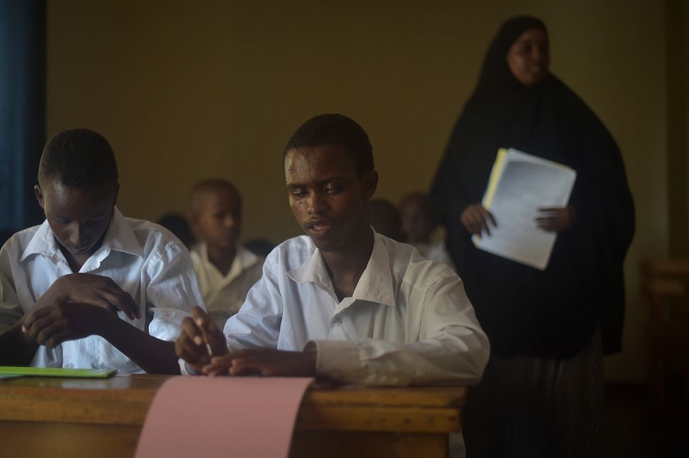 A child with impaired eyesight practices writing braille at the Al-Nor School for the Blind in Mogadishu, Somalia, on…