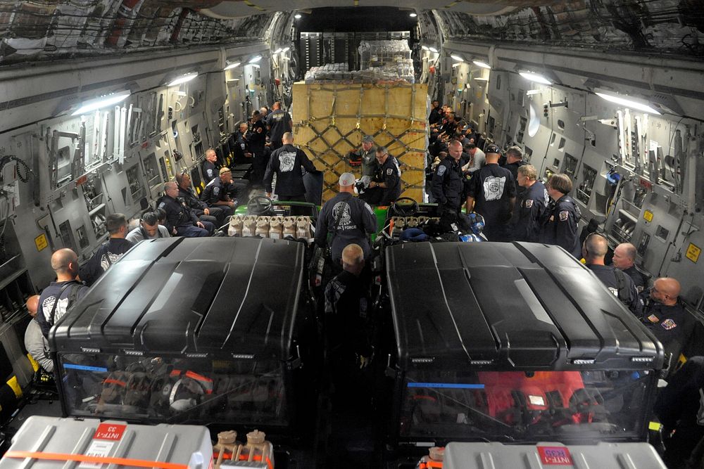 Federal Emergency Management Agency Urban Search and Rescue Task Force members board a U.S. Air Force C-17 Globemaster III…