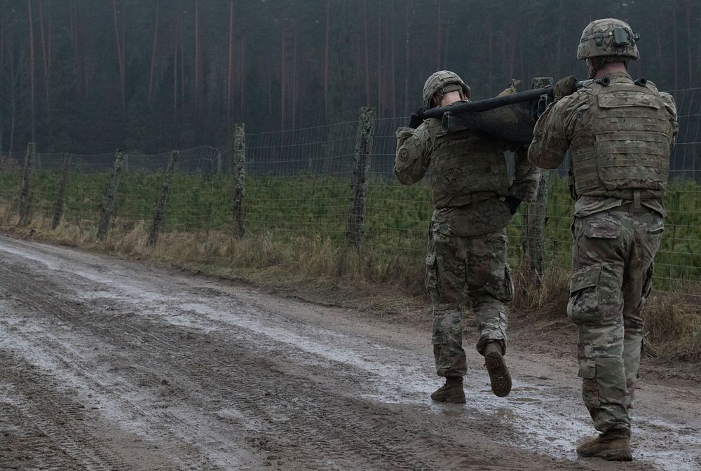 U.S. Soldiers assigned to the 3rd Squadron, 2nd Cavalry Regiment carry a weighted litter on the second day of the unit’s 3…