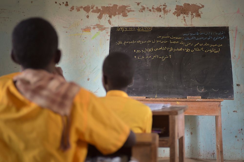 Somali boys sit in class at a school in El Baraf, Somalia. Original public domain image from Flickr