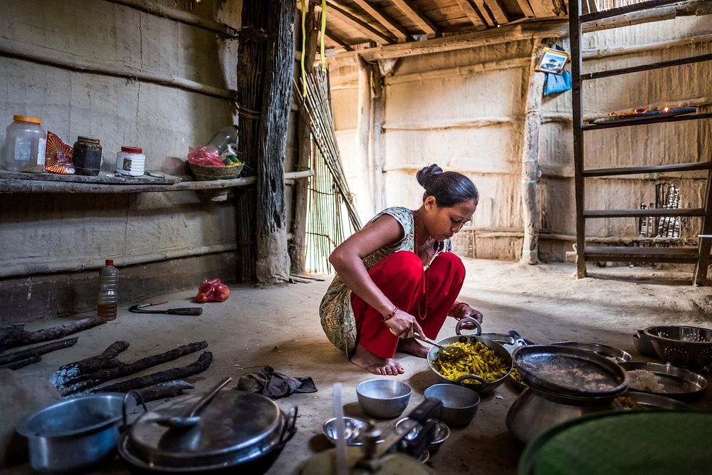 Woman cooking in local kitchen, Kumrose, Nepal, November 2017.