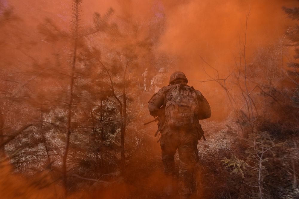U.S. Army Paratroopers, assigned to 2nd Battalion, 503rd Infantry Regiment, 173rd Airborne Brigade, run through smoke on the…
