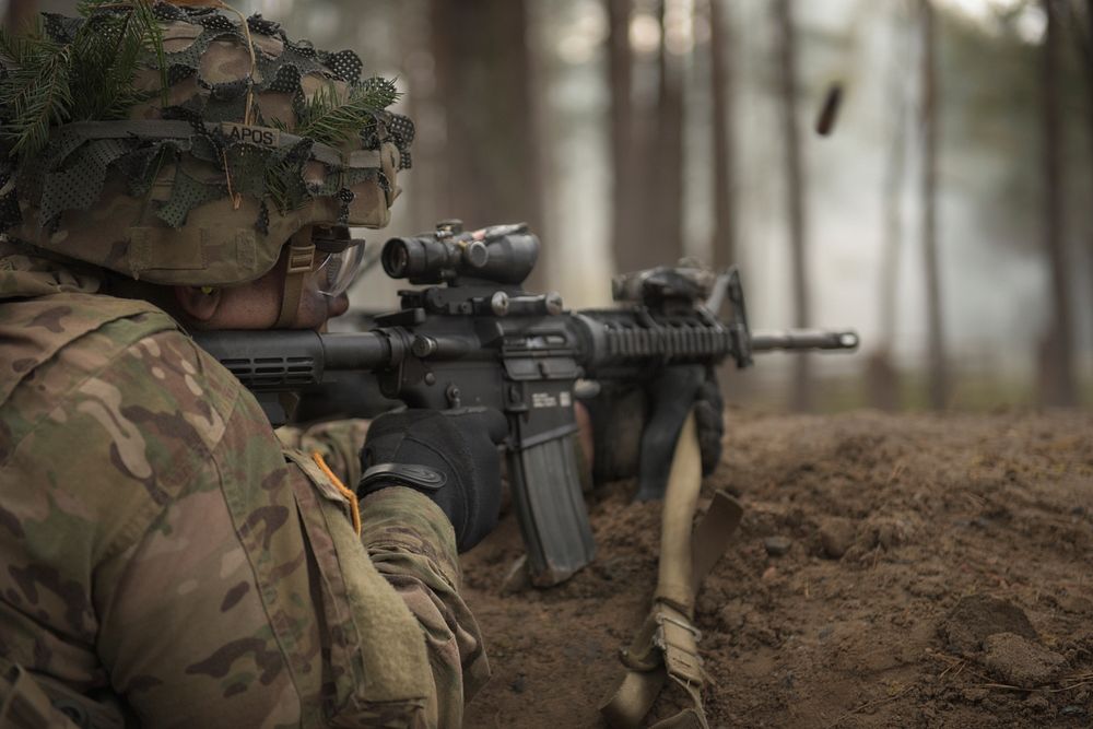 A U.S. Soldier assigned to the 173rd Airborne Brigade fires an M4 rifle during a company live-fire part of exercise Eagle…