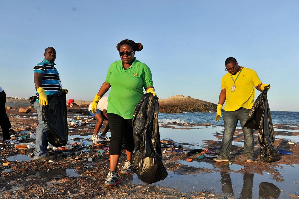 Staff of the African Union Mission in Somalia (AMISOM) collect garbage during a beach clean-up exercise in Mogadishu…