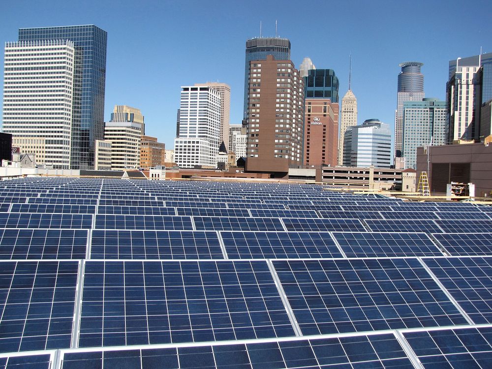 The 600kw solar electric system installation on the Minneapolis convention center. local installers inspecting PV panels…