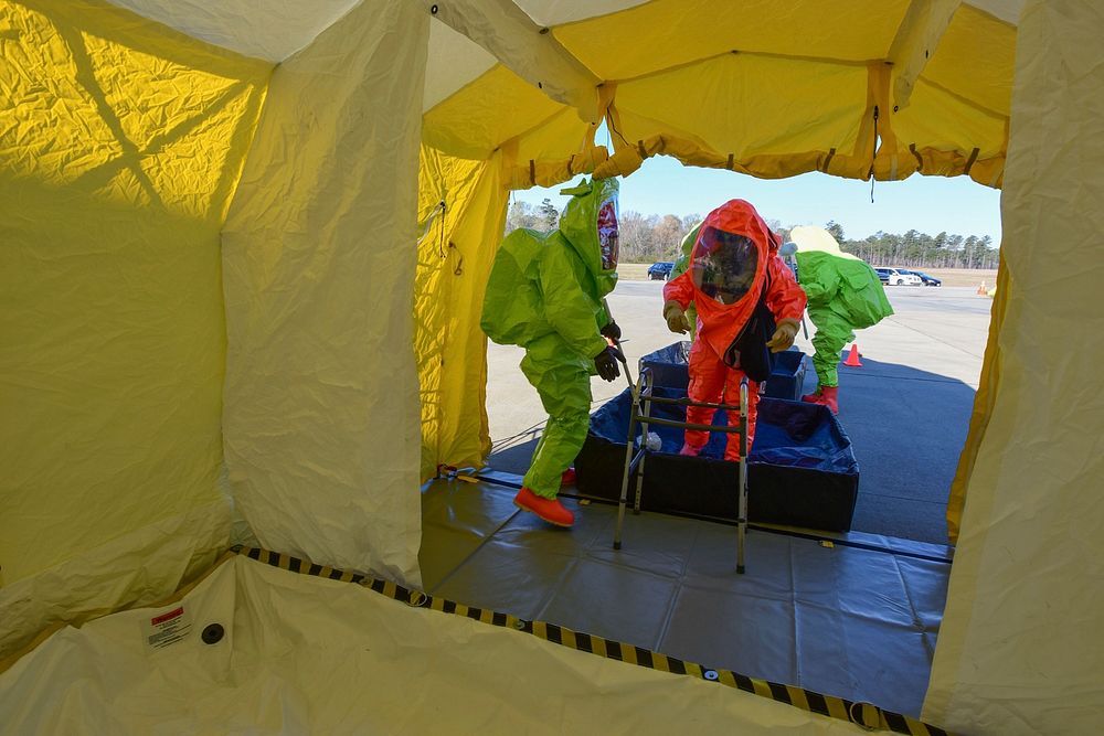U.S. Air Force firefighters processed through a decontamination area during a hazardous material exercise at McEntire Joint…