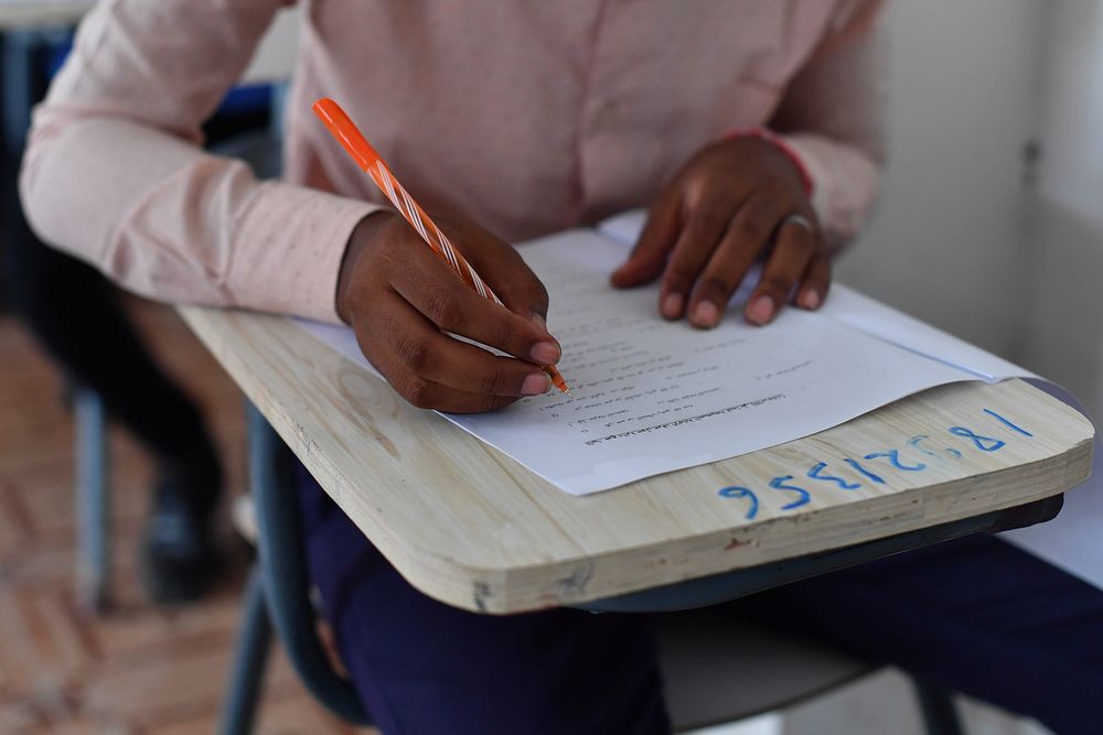 Secondary students take their national examinations in Mogadishu, Somalia. Original public domain image from Flickr