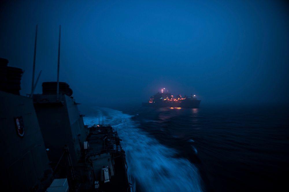The forward-deployed Arleigh Burke-class guided-missile destroyer USS Barry (DDG 52) leaves the Military Sealift Command…