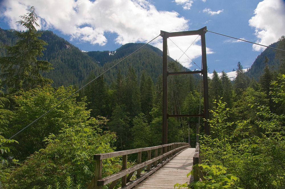 Pacific Northwest Trail suspension bridge over the Baker RiverThe Pacific Northwest Trail crosses the Baker River, Mt. Baker…