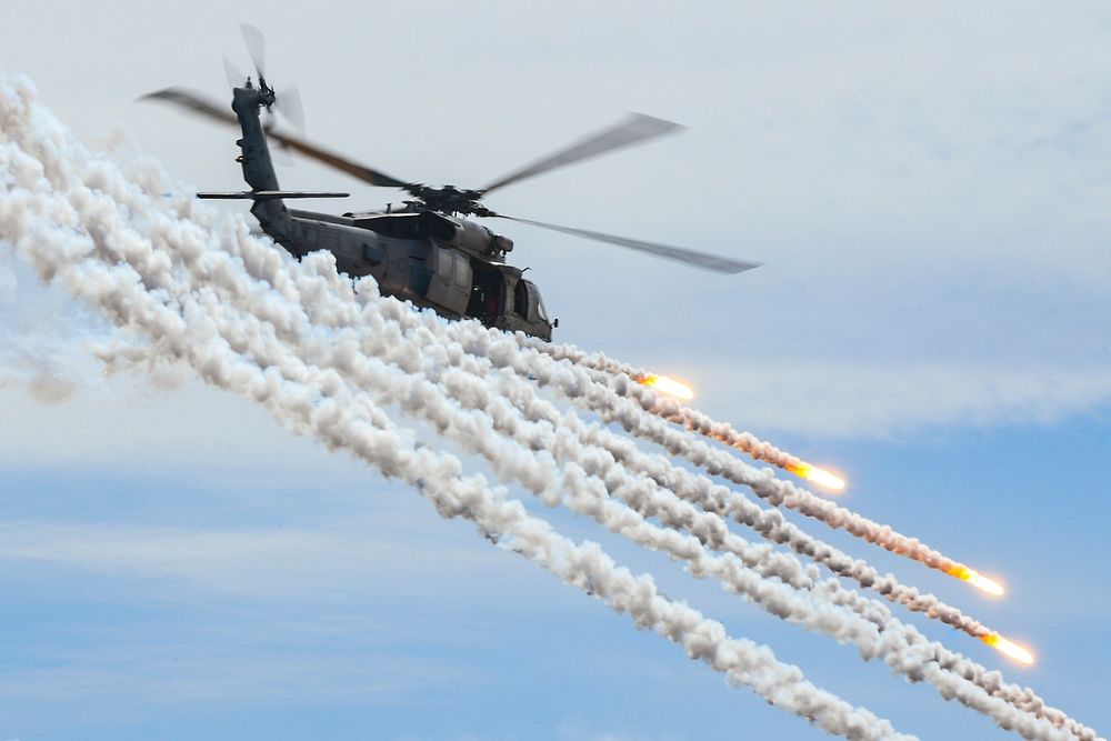 A U.S. Navy MH-60S Sea Hawk helicopter assigned to the Indians of Helicopter Sea Combat Squadron (HSC) 6, fires flares…