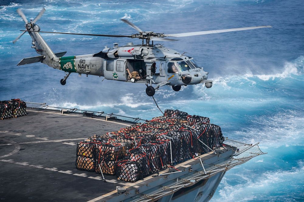 An MH-60S Sea Hawk helicopter assigned to the Dusty Dogs of Helicopter Sea Combat Squadron (HSC) 7 prepares to deliver cargo…