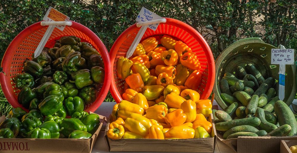 Green and yellow peppers, and cucumbers are some of the produce available from vendor at the U.S. Department of Agriculture…