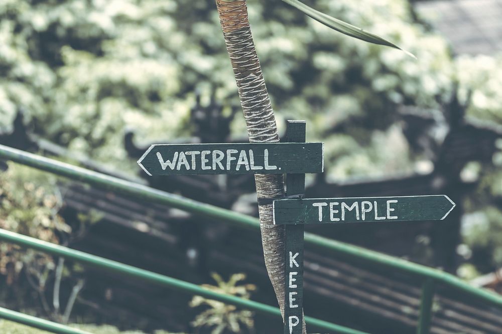 Waterfall sign in the jungle of Bali island.