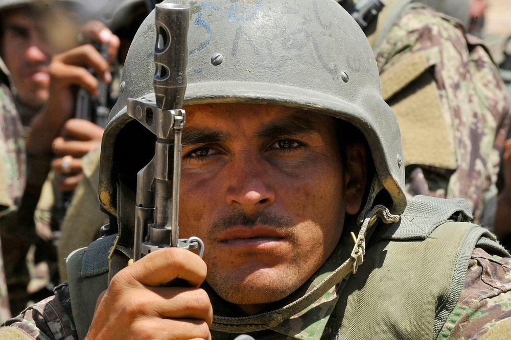 An Afghan National Army-Territorial Force member watches security demonstrations during an exercise at the Kabul Military…