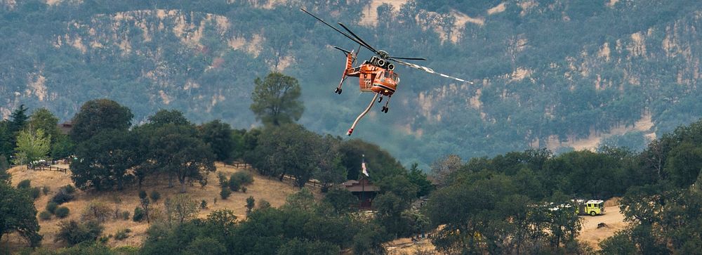 Cedar Fire operations include helicopter release of water where needed during the Cedar Fire in the Sequoia National Forest…