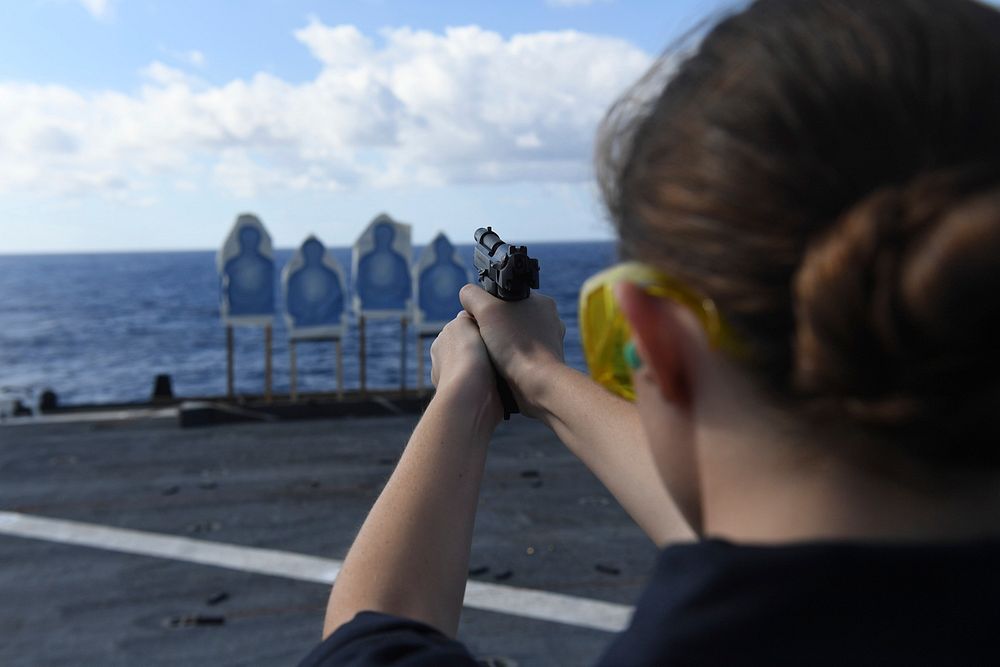MEDITERRANEAN SEA (Oct. 8, 2016) Seaman Brittany Mozingo, from Greenville, N. C., fires a 9mm pistol during a small arms…