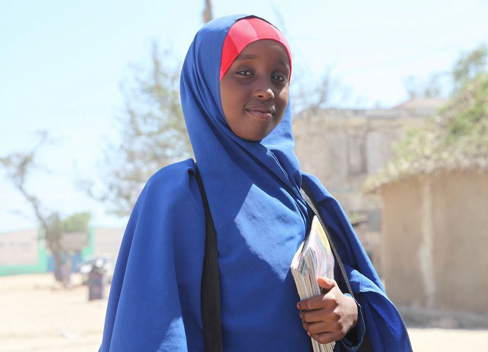 Yasmin Ali Hassan, a pupil at Ahmed Bin Hanbal Primary and Secondary School poses for a photo in Kismaayo town, Jubbaland…