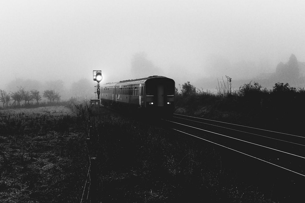 Train in misty morning. Original public domain image from Flickr