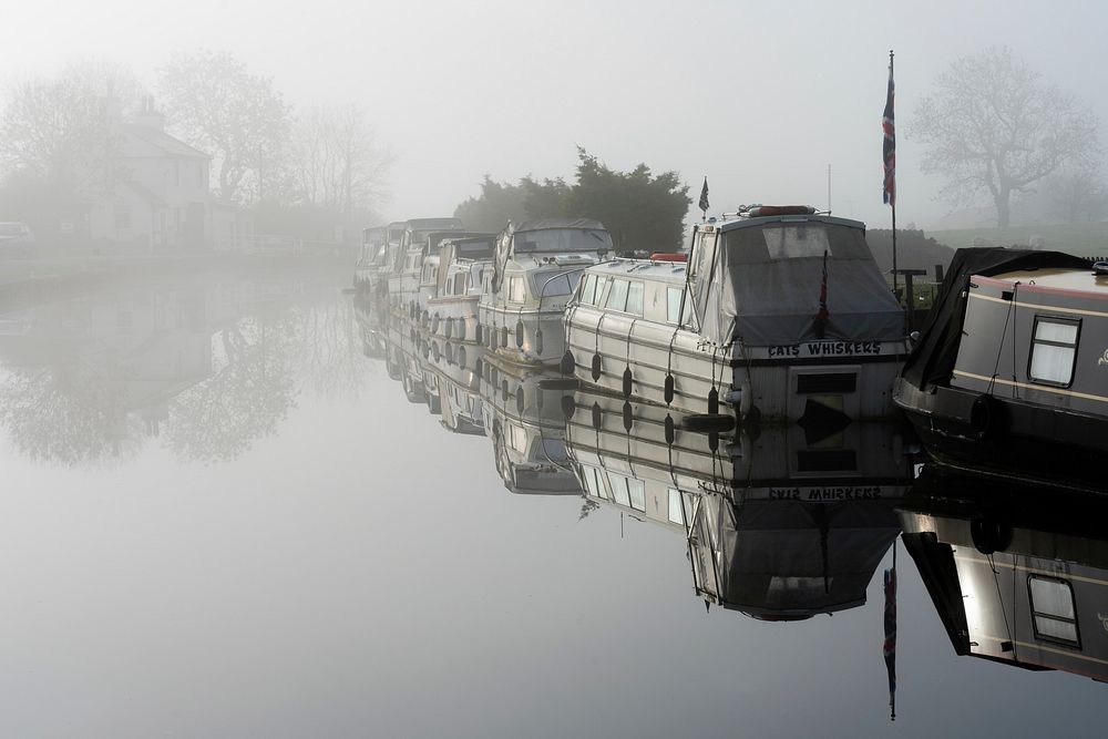 Boats on foggy canal. Original public domain image from Flickr