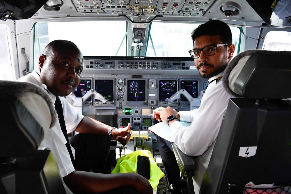 Capt. Charles Waruru, with his co-pilot, pose a photograph at Adan Adde International Airport in Mogadishu, Somalia on 18…