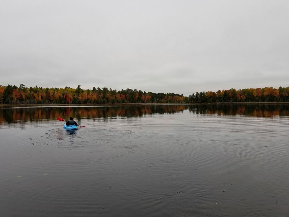 Take in the peace and quiet (and fall colors) from your kayak at Emily Lake campground near Lac Du Flambeau, WI on the…