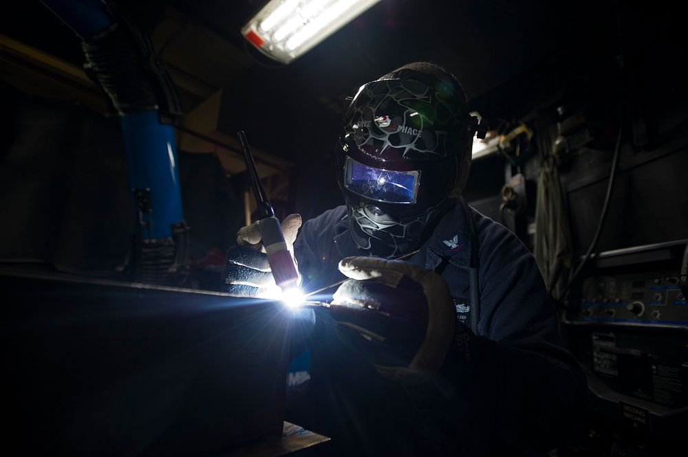 161020-N-WS581-013..ARABIAN GULF (Oct. 20, 2016) Petty Officer 3rd Class Cullen Kyser, from Youngstown, Ohio, welds together…