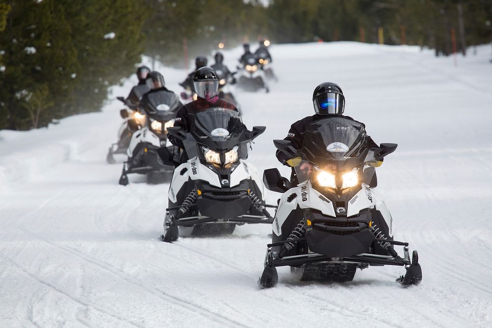 Guided snowmobile group on the West Entrance Road NPS / Neal Herbert. Original public domain image from Flickr