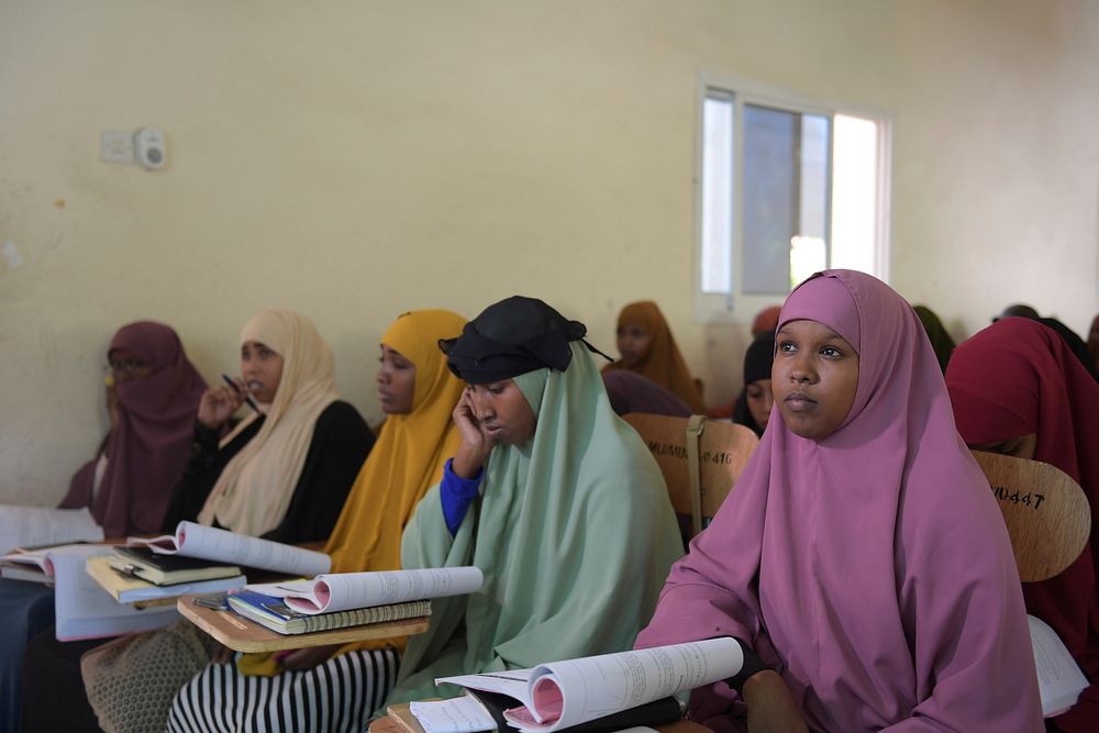 Students of Mogadishu University attend a lecture at the university campus in Somalia on April 30, 2017. AMISOM Photo /…