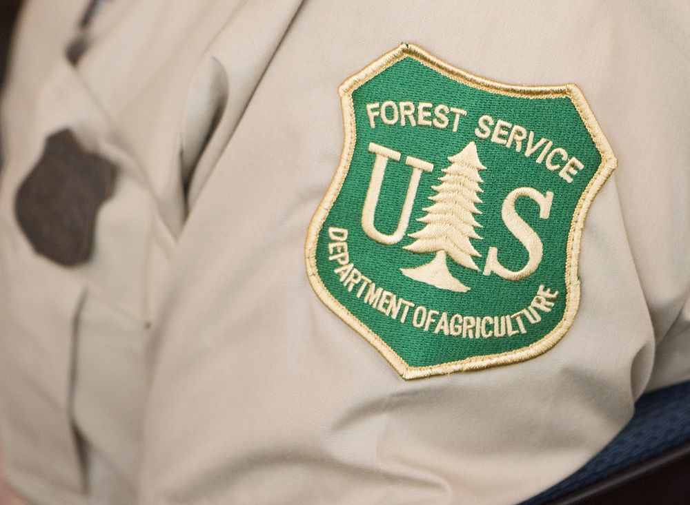 U.S. Department of Agriculture (USDA) Secretary Sonny Perdue, blue shirt, and Interior (DOI) Secretary Ryan Zinke, tan…