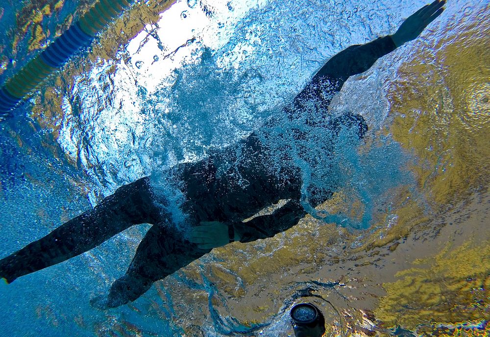 A U.S. Air Force airman from the New Jersey Air National Guard's 108th Security Forces Squadron swims the 100 meter…