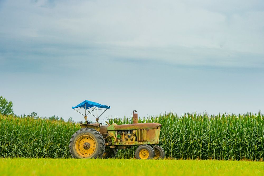Scenic landscape of Cornfield and old tractor near Lyons, Georgia, June 20, 2017. USDA photo by Preston Keres. Original…