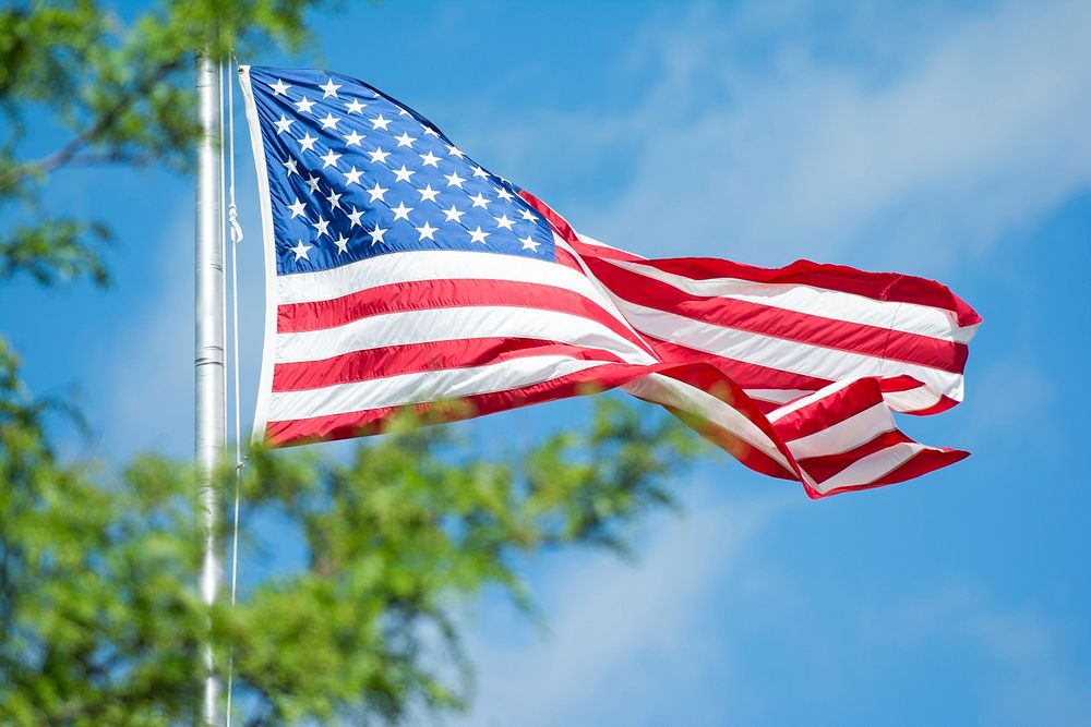 American flag against blue sky. Original public domain image from Flickr