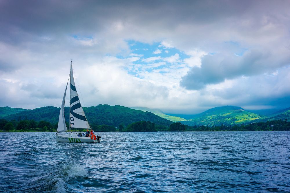 Beautiful lake and sailboat. Original public domain image from Flickr