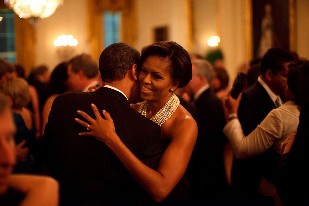 President Barack Obama and First Lady Michelle Obama dance while the band Earth, Wind and Fire performs at the Governors…