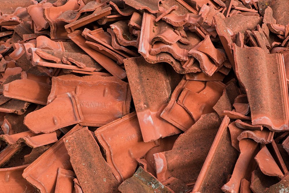 Broken clay roof tiles. Free public domain CC0 photo.