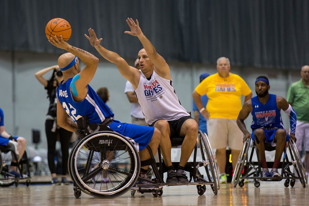 U.S. Army Sgt. 1st Class Earl Ohlinger, from Savannah, Ga., plays defense during a practice for the wheelchair basketball…