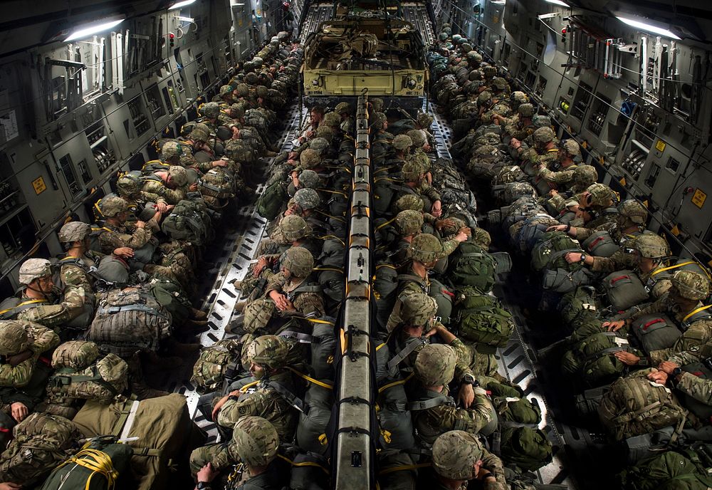 U.S. Soldiers of the 82nd Airborne Division prepare to conduct a static line jump out of a C-17 Globemaster III during…