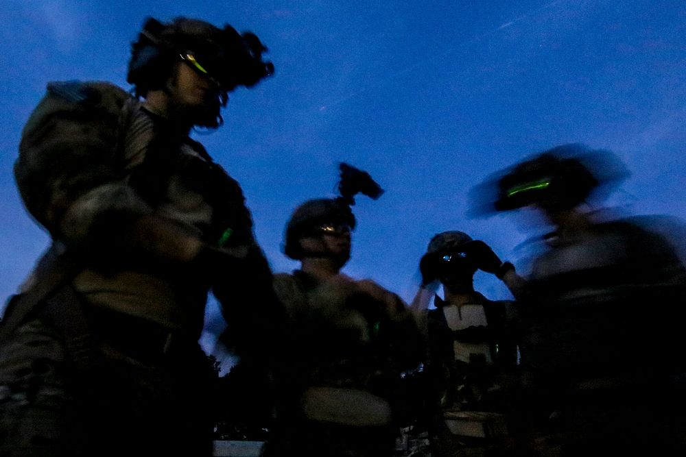 U.S. Air Force tactical control party airmen from the 227th Air Support Operations Squadron put on night vision devices…