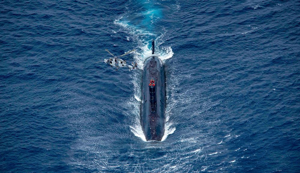 ATLANTIC OCEAN (Aug. 5, 2017) Royal Navy Trafalgar-class submarine HMS Trenchant and Royal Navy Wildcat HMA2, attached to…