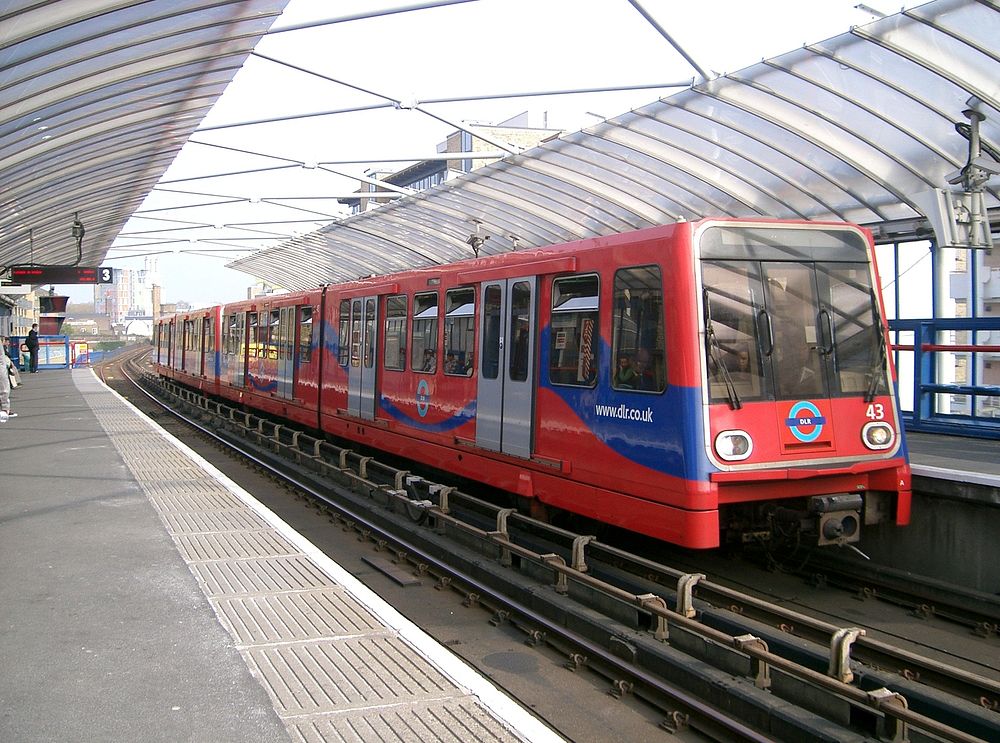 A London Docklands Light Railway train headed by B90 unit No.43 calls at a station - the name of which alas I do not recall.