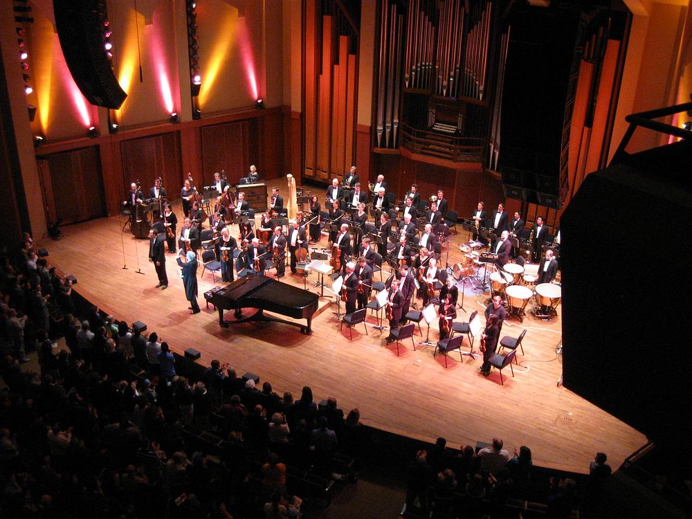 Orchestra standing for applause in Benaroya Hall 1. Kevin Cole (piano player) in left on front, Marvin Hamlisch (conductor)…