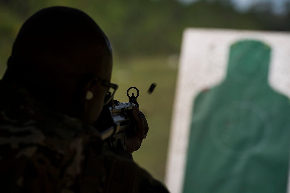 Chief Master Sergeant of the Air Force Kaleth O. Wright fires a weapon during a Dynamics of International Terrorism…