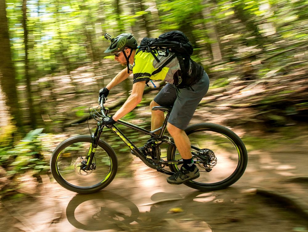 Aron Smith mountain bikes through the Pisgah National Forest, NC. Original public domain image from Flickr