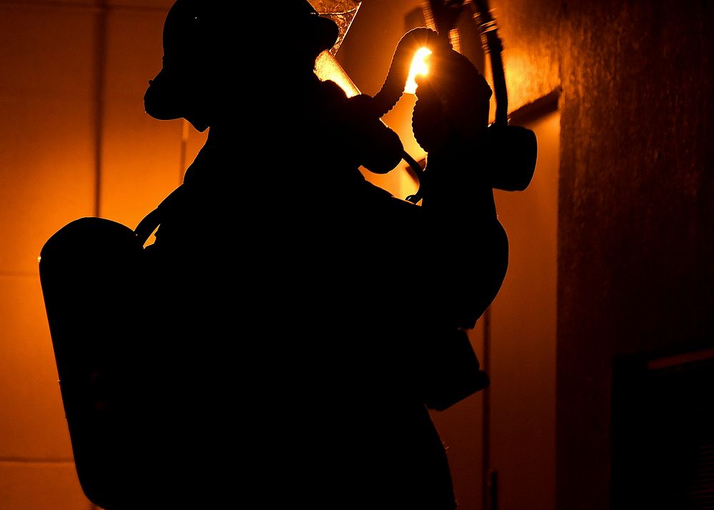 A U.S. Air Force firefighter assigned to the 51st Civil Engineering Squadron responds to a simulated fire as part of…