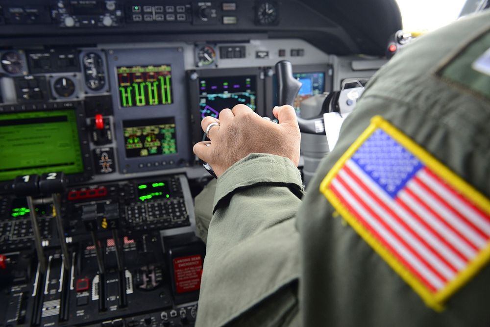 Lt. Christopher Capule, an Air Station Corpus Christi pilot, makes midair adjustments during a flight to San Angelo, Texas…