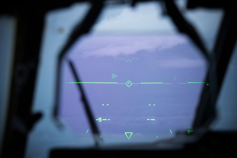 A heads-up display shows the directional markers inside a U.S. Air Force WC-130J Super Hercules Hurricane Hunter aircraft…
