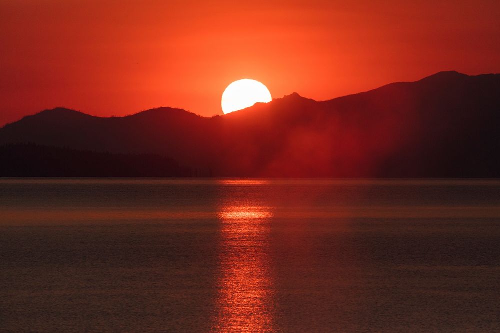 Hazy sunrise from West Thum Geyser Basin. Original public domain image from Flickr